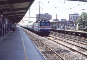 Amtrak | New Brunswick, New Jersey | AEM7 #945 | Train 140 | New Brunswick, NJ ex PRR Station | August 26, 1984 | Richard Prince