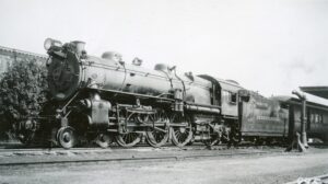 Pennsylvania Railroad | Chambersburg, Pennsylvania | K2sa 4-6-2 #1387 steam locomotive | Station | Water plug | June 16, 1940 | John Bowman, Jr. photpgraph