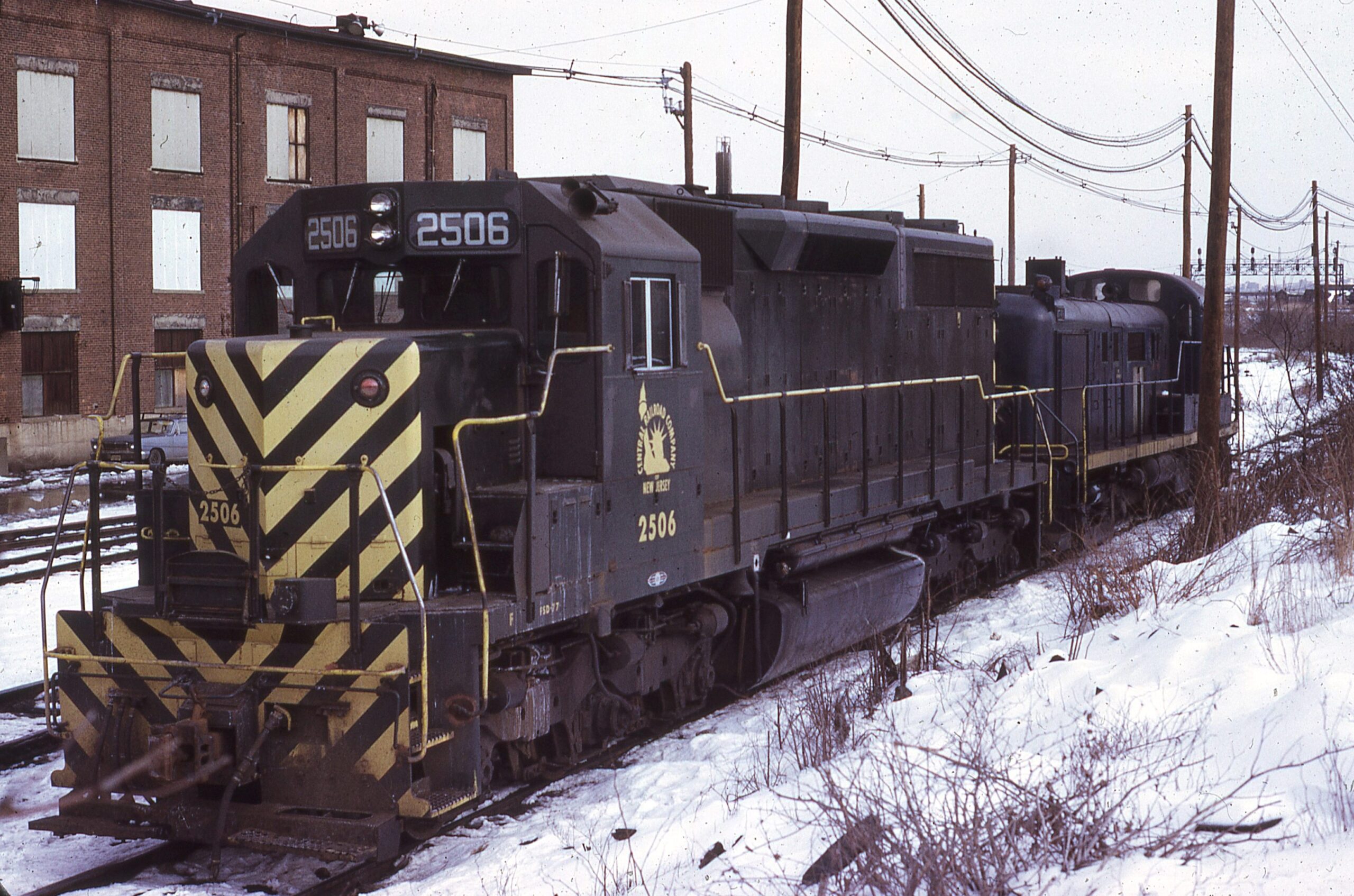 Central Railroad of New Jersey | Elizabethport, New Jersey | SD35 2506 & RS3 | Elizabethport shops | February 1976 | Larry Steingarten photograph