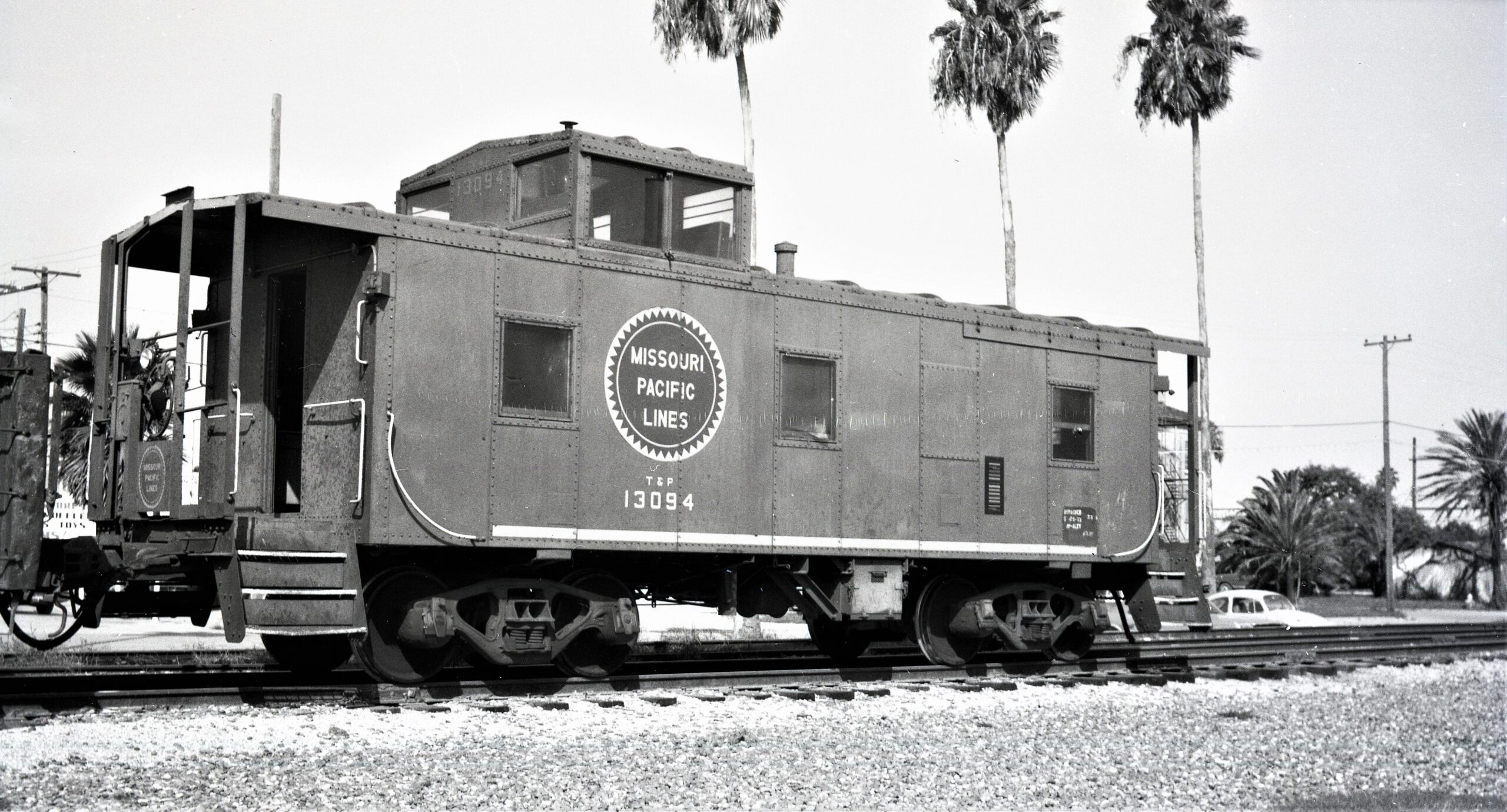 Missouri Pacific | ex Texas and Pacific | San Benito, Texas | Caboose #13094 | December 1948 |Baldwin Locomotive Works photograph | Elmer Kremkow Collection