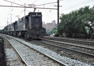 Conrail | Elizabeth, New Jersey | E44 #4406 + 2 + diesel | westbound freight | August 1977 | Larry Steingarten photograph