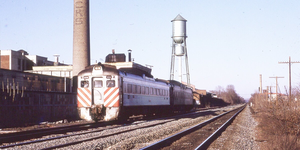 Central Railroad of New Jersey Plainfield, New Jersey passing Mack Truck plant RDC1 556+1 westbound local March 1976 Larry Steingarten photograph