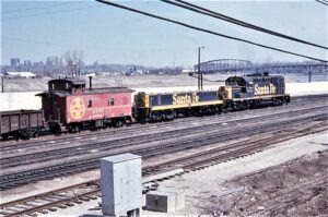 Atchison Topeka and Santa Fe Railway | Kansas City, Kansas | Alco RSD15 #9824 diesel-electric locomotive and Slug #9853 + caboose | Argentine Yard | March 23, 1974 | Richard Prince photograph