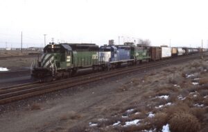 Burlington Northern | Pasco, Washington | EMD SD40-2 #8082, EMD SD40-2 #6303 and GE B30-7AB #4046 diesel-electric locomotives | Trin #196 | February 27, 1994 | Dick Flock photograph
