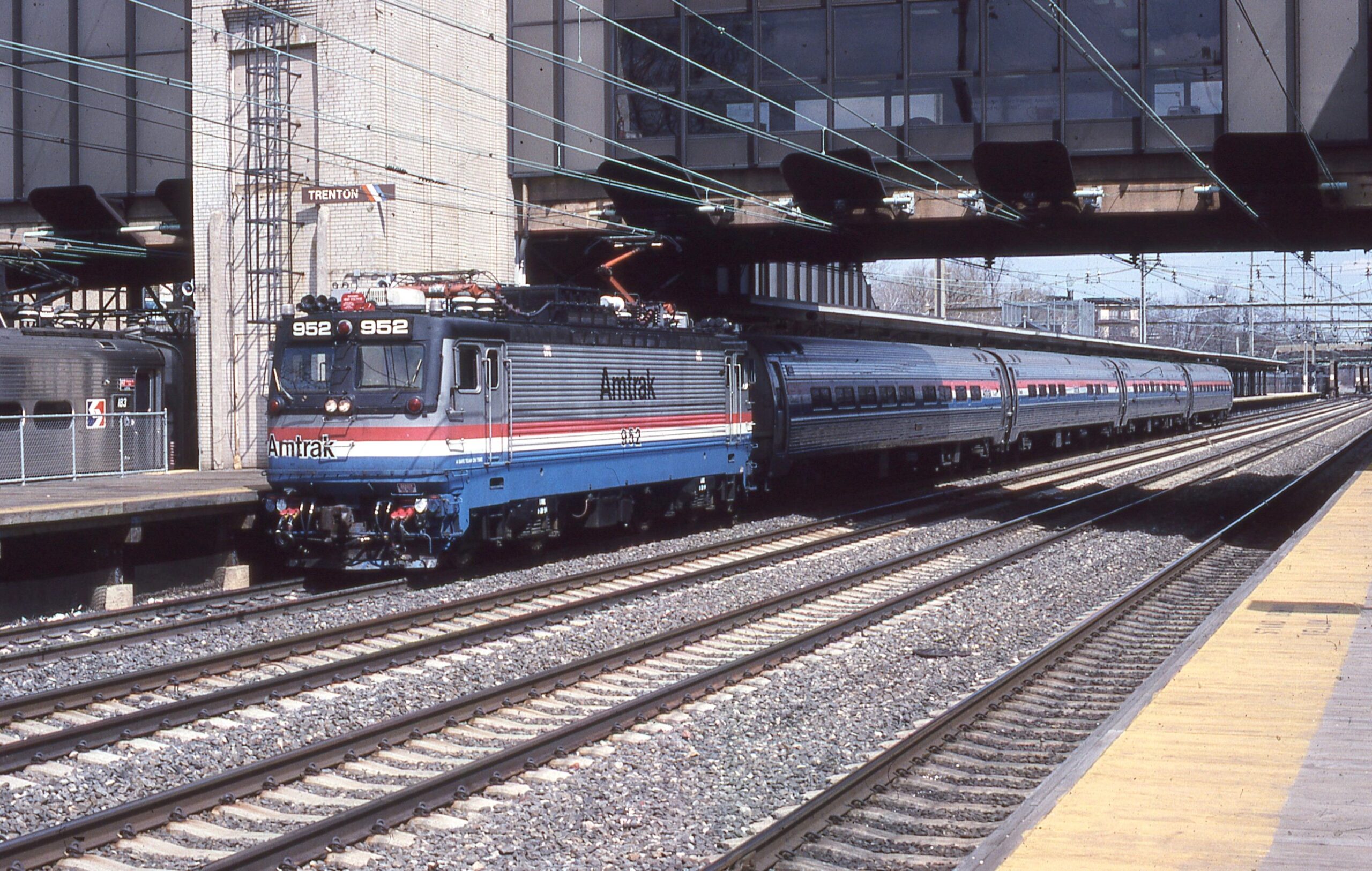 Amtrak | Trenton, New Jersey | EMD AEM-7 #952 electric | Atlantic City Passenger train | Trenton NJ Station | April 1, 1995 | William Rosenberg photograph