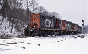 Canadien National | Hamilton, Ontario, Canada | EMD GP9m #7034 diesel-electric locomotive and train | January 10, 1993 | Dick Flock photograph