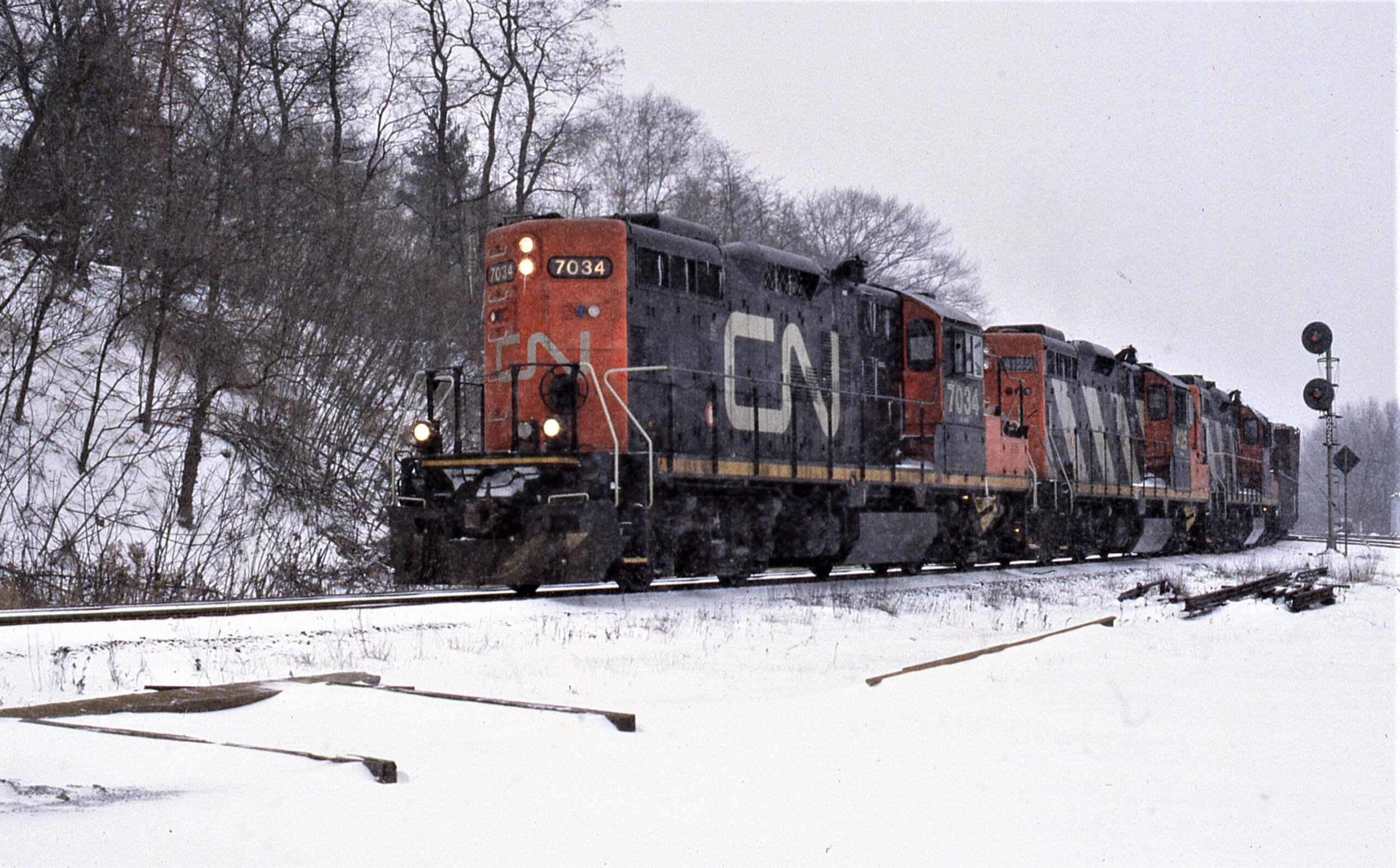 Canadien National | Hamilton, Ontario, Canada | EMD GP9m #7034 diesel-electric locomotive and train | January 10, 1993 | Dick Flock photograph