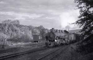 East Broad Top | Orbisonia, Pennsylvania | 2-8-2 #18 narrow gauge steam locomotive | Coal hoppers | October 1954 | Fielding Lew Bowman photograph