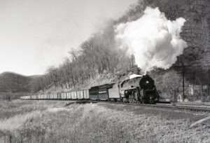 Reading Company | Pennsylvania Railroad | Farrandsville, Pennsylvania | T1 4-8-4 #2117 steam locomotive and train | November 10, 1956 | John Bowman, Jr. photograph
