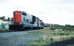 Canadien National | Bishop Falls, Newfoundland, Canada | GMC NF110 #935 + 1 diesel-electric locomotives and train | September 1978 | Larry Steingarten photograph