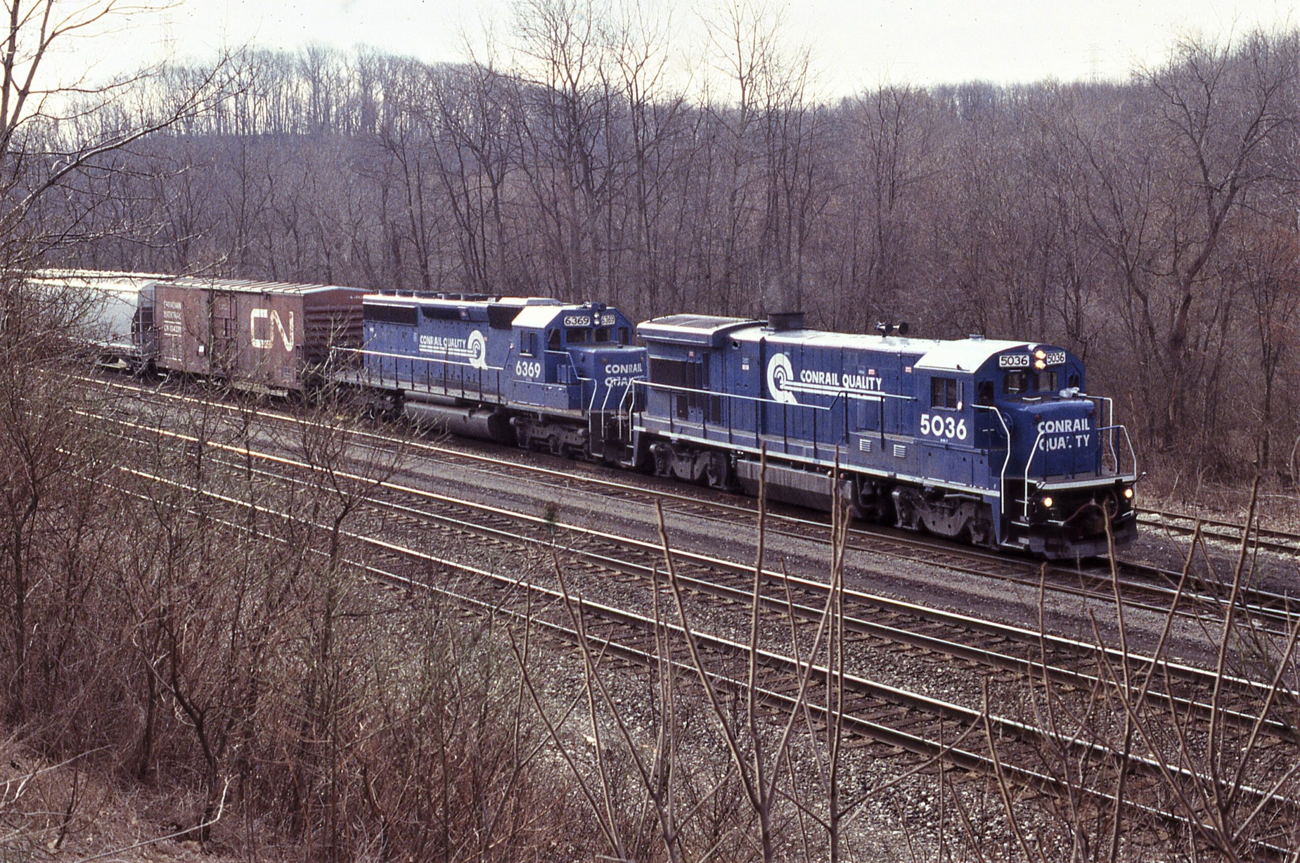 Conrail | Radebaugh, Pennsylvania | GE B36-7 #5036 and EMD SD40-2 #6369 diesel-electric locomotives | setting out | March 27, 1988 | Dick Flock photograph