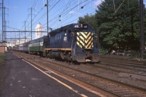 New Jersey Department of Transportation | South Elizabeth, N.J. | EMD GP40P #4111 | westbound commuter train | Elmora tower | September 1979 | William Rosenberg photograph
