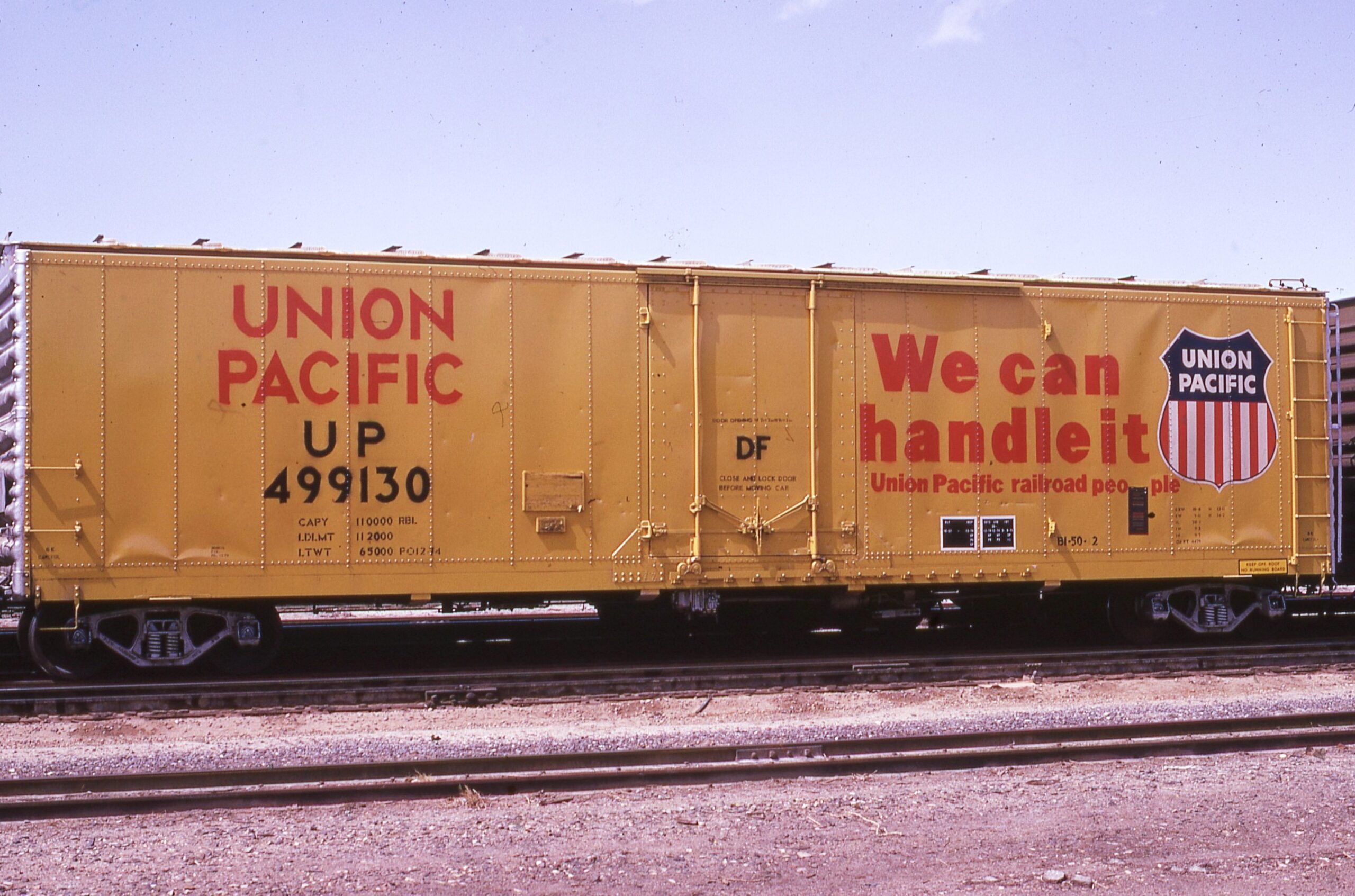 Union Pacific | Las Vegas, Nevada | New We Can Handle It 50 foot 6 inch box car #499130 | March 27, 1975 | Steve Timko Collection