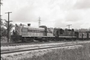 Erie Lackawanna | Marion, Ohio | Alco Class RS3 #1009 and EMD GP9 #1221 diesel-electric locomotives | Caboose hop | 1968 | Elmer Kremkow photograph