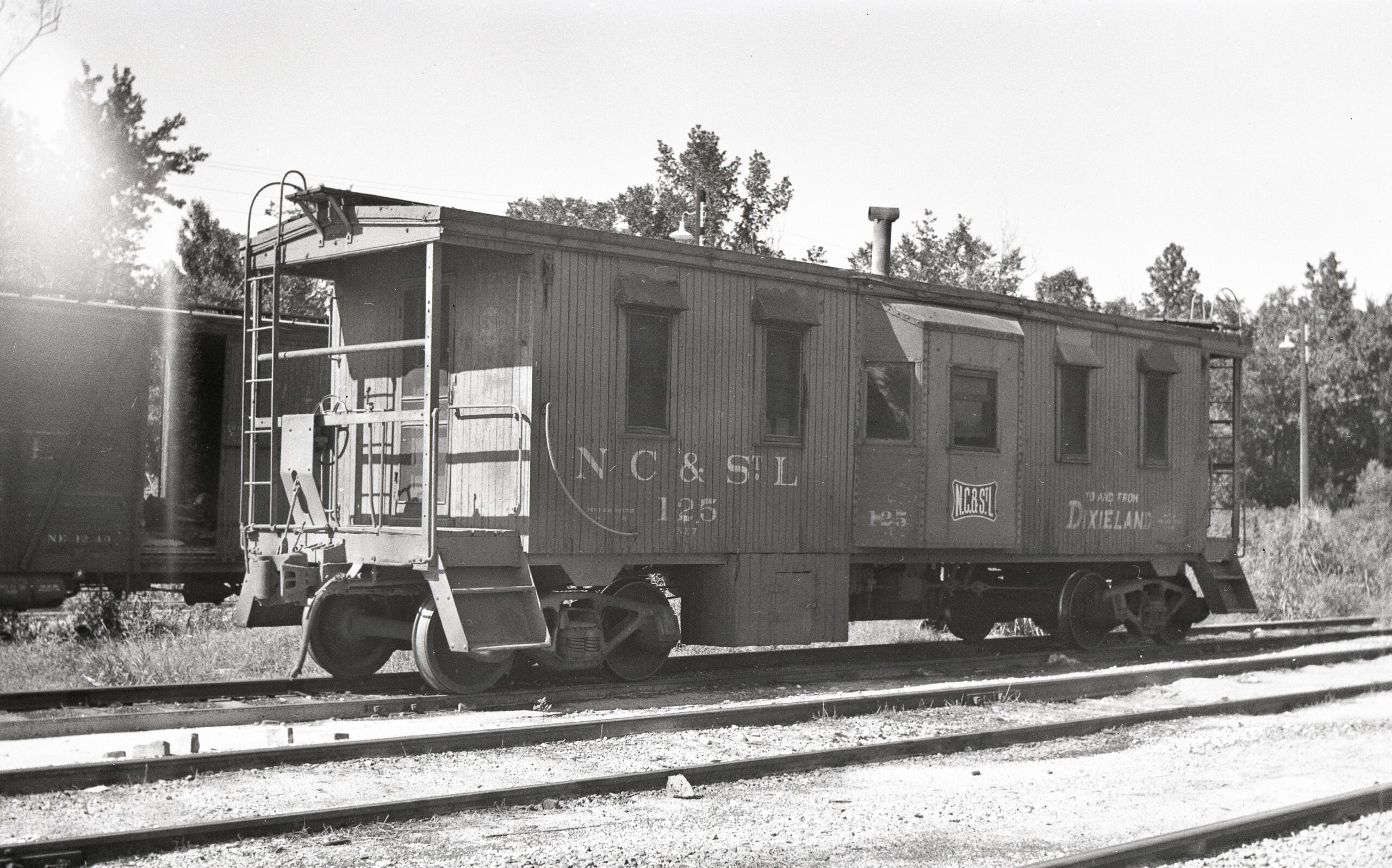 Nashville Chattanooga and Saint Louis Railway | Louisville and Nashville | Sterling, Kentucky | Wooden Bay window caboose #125 | To and From Dixieland | July 1962 | H.B.Olsen photograph