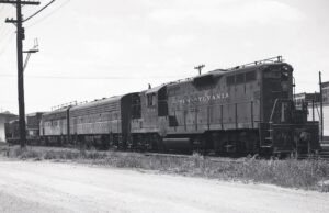 Pennsylvania Railroad | Altoona, Pennsylvania | EMD Class GP9 #7115 + F7 B and A diesel-electric locomotives | TV Train | 1960 | Elmer Kremkow photograph
