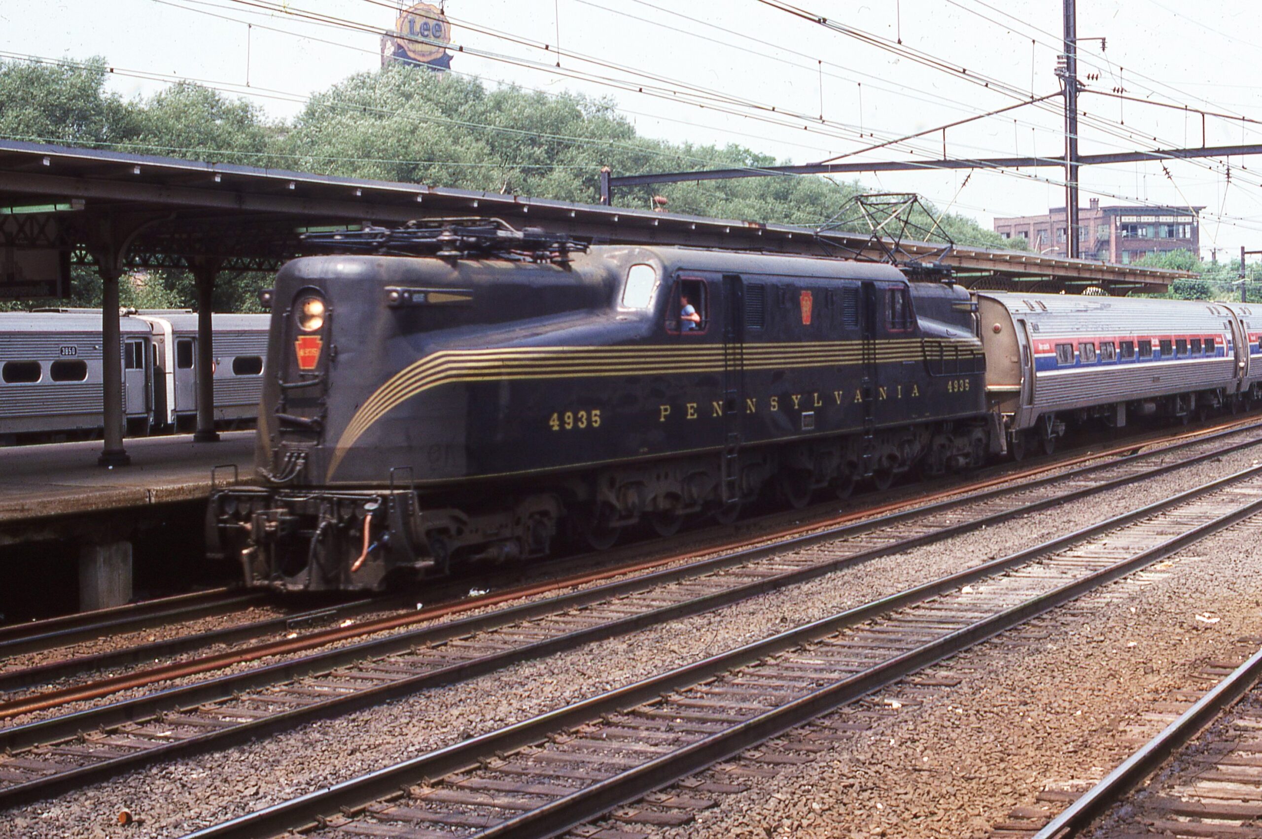 Amtrak | Pennsylvania Railroad | Trenton, New Jersey | Altoona Works class GG1 #4935 electric-motor | Passenger train | Trenton NJ Station | July 1978 | William Rosenberg photograph