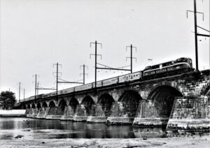 Pennsylvania Railroad | Morrisville, Pennsylvania | Class GG1 #4887 electric motor | Budd Keystone train | Delaware River Bridge | October 19,1961 | Frank Tatnall photograph