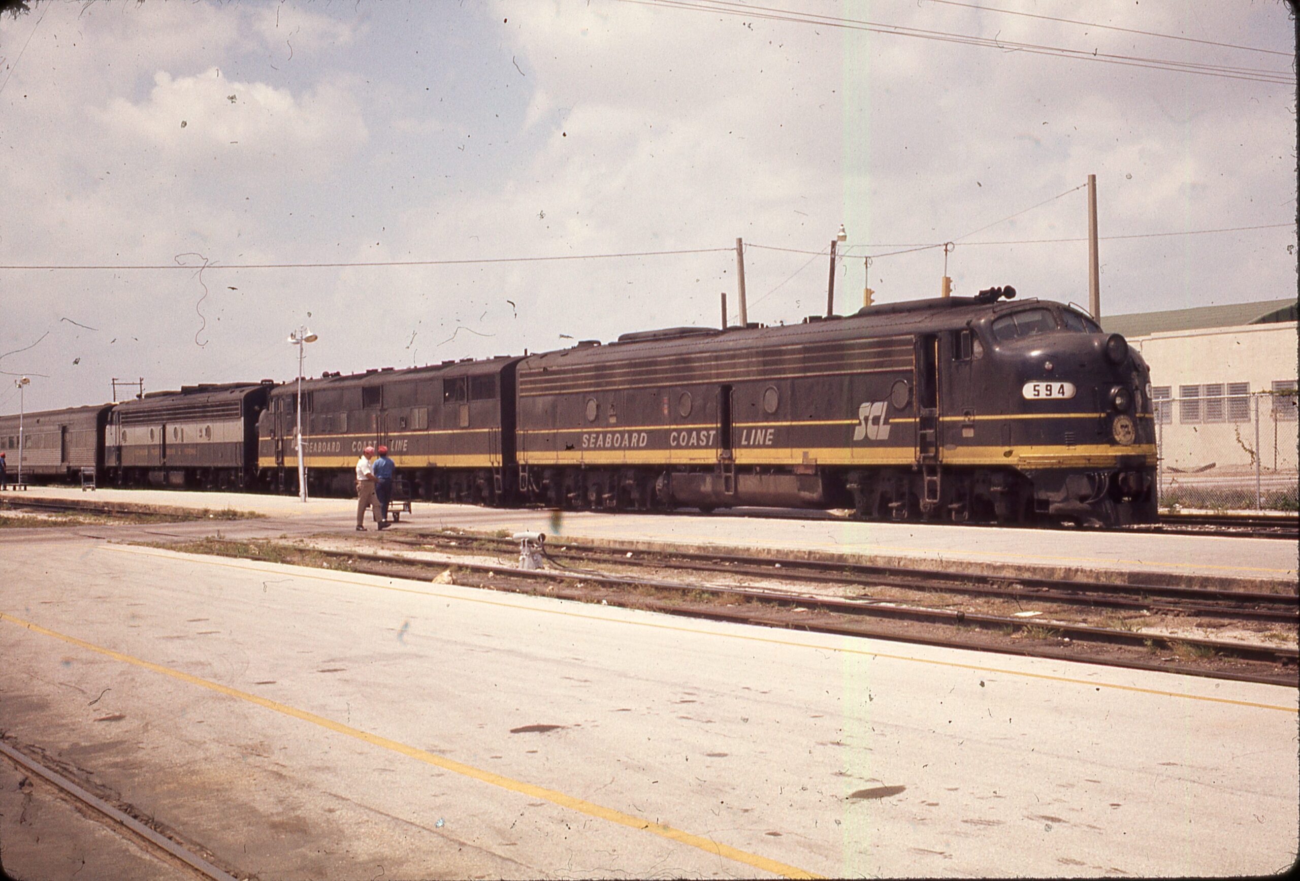 Amtrak | Seaboard Coast Lines | EMD E8a #594 + 2 diesel-electric locomotives | Train 87 Florida Special | April 11, 1972 | Steven Timko collection