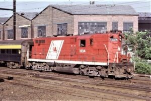 Central Railroad of New Jersey | Harrison, New Jersey | EMD GP7 #1524 Red Baron diesel-electric locomotive | Commuter Train | July 1974 | William Rosenberg photograph | Morning Sun Books Collection