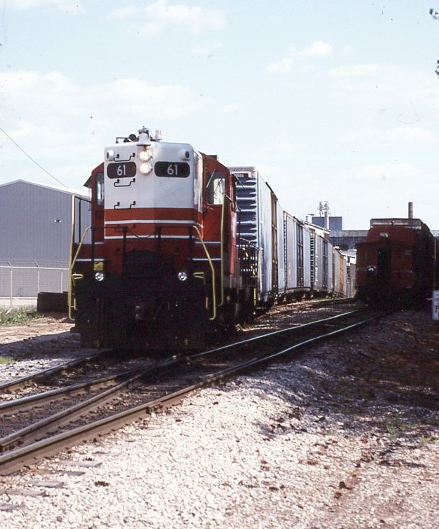 Indiana and Ohio Railroad | Lancaster, Ohio | EMD GP9 #61 diesel-electric locomotive | freight train | vertical image | Anchor Hocking Plant | April 24, 1998 | John Roberts photograph | Dick Flock collection