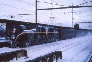 Pennsylvania Railroad | Philadelphia, Pennsylvania | Class GG1 #4913 electric motor | Passenger Train | North Philadelphia Station | January 1961 | David Sweetland photograph | Richard Prince Collection
