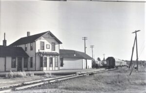 Soo Line | Trout Lake, Michigan | Passenger Train | Crossing with Canadian National and Soo Line | Trout Lake Passenger Station | 1955 | Fielding Lew Bowman photograph