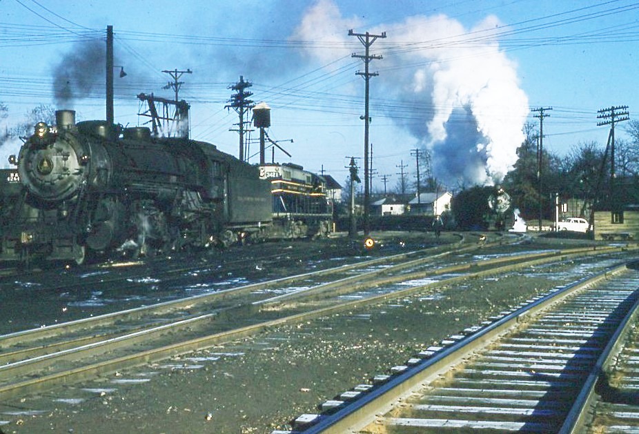 Baltimore and Ohio | North Vernon, Indiana | Q3 class 2-8-2 #329, EMD GP9 #3421 diesel, Q3 class 2-8-2 #385 steam locomotives | January 1,1958 | Frank Kozempel photograph