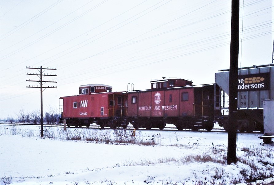 Norfolk and Western Railway | Toledo, Ohio | Caboose #557748 and 555089 | December 16,1976 | Elmer Kremkow photograph