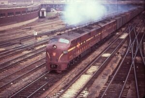 Pennsylvania Railroad | Chicago, Illinois | Class EMD E7a 5957 + 1 diesel-electric locomotive | Mail Train | June 3,1963 | R.R. Wallin photograph | Richard Prince Collection