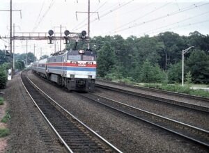 Amtrak | Iselin, New Jersey | Metropark Station | GE E60 #956 electric motor. | Amtrak intercity passenger train | July 1977 | William Rosenberg photograph | Morning Sun Books collection