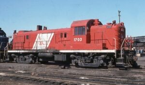 Central Railroad of New Jersey | Elizabethport, New Jersey | Alco RS3 #1703 diesel-electric locomotive | Red Barron Coast Guard color scheme | March 28, 1976 | Jack DeRosset photograph | Morning Sun Books collection