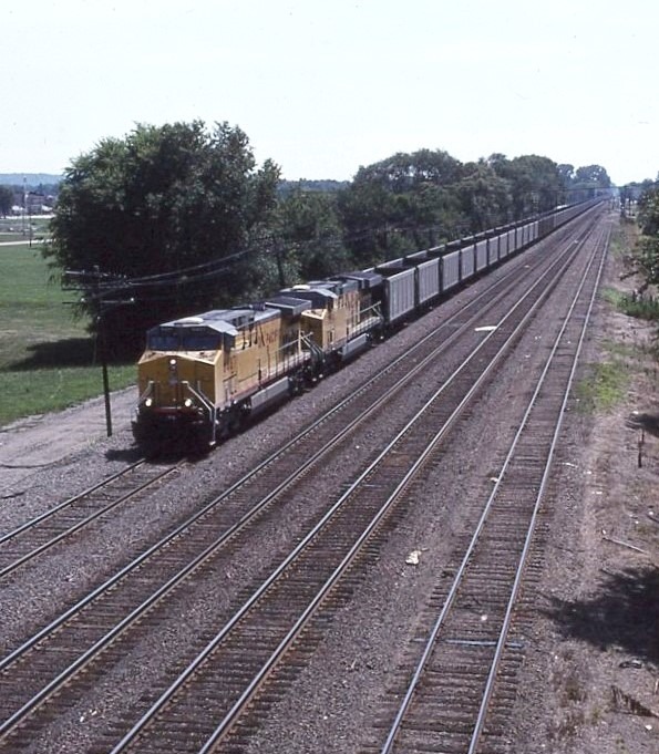 Union Pacific | East Saint Louis, Illinois | GE AC4400CW #6487 and AC44CW 7049 diesel-electric locomotives | July 8, 2001 | Dick Flock photograph