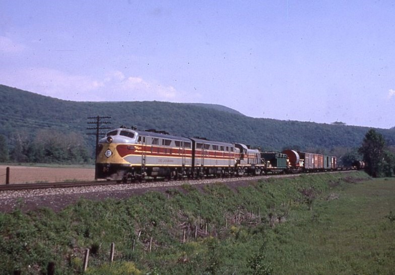 Erie Lackawanna | Stroudsburg, Pennsylvania | EMD F7a #6064 + 2 diesel electric locomotives | west bound freight train | June 1967 | Dave Augsburger photograph | C. Anderson collection