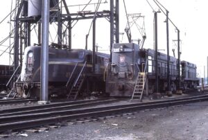 Pennsylvania Railroad | Wilmington, Delaware | Class GE E44 #4400 and Altoona Works GG1 #4863 electric motors | Sanding towers | June 21, 1964 | Henry Bielstein photograph