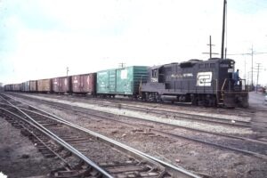 Penn Central Transportation Company | Marion, Ohio | Class EMD GP9 #7264 diesel-electric locomotive | freight train | April 1976 | Elmer Kremkow photograph
