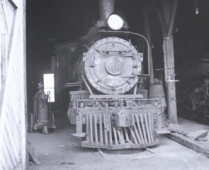 Rio Grande Southern | Durango, Colorado | ALCO Class T-19 4-6-0 #20 steam locomotive | head on view in engine house | September 1952 | Fielding Lew Bowman photograph