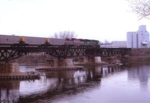 Burlington Northern | Minneapolis, Minnesota | EMD SD60M #9260 + EMD SD60E #8301 diesel-electric locomotives | freight over bridge | May 9, 1995 | Dick Flock Photograph