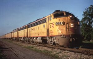 Milwaukee Road | Newport, Minnesota | EMD FP7a #102 A + + 2 diesel-electric locomotive | Afternoon Twin Cities Hiawatha passenger train | June 4, 1968 | David Sweetland photograph | Richard Prince collection
