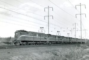 Pennsylvania Railroad | Edison, New Jersey | Baldwin/GE Class GG1 #4800 + 4 electric motors | westbound light move | November 24, 1963 | Jim Shaunessy photograph
