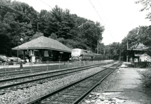 Amtrak | ex Pennsylvania Railroad main-line | Merion, Pennsylvania | GE Class P42DC #104 diesel-electric locomotive | Train #648 | Passenger station | June 25, 2002 | Will Coxey photograph
