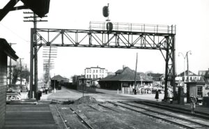 Central Railroad of New Jersey | New York and Long Branch Railroad | Belmar, New Jersey | Passenger Station | Overhead signal bridge at grade crossing | February 23, 1952 | R.L. Long photograph | West Jersey Chapter, NRHS Collection