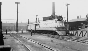 Chicago Milwaukee Saint Paul and Pacific Railroad | aka Milwaukee Road | Bensenville, Illinois | Class A 4-4-2 #1 streamlined Hiawatha steam locomotive | at roundhouse | November 25, 1937 | West Jersey Chapter, NRHS Collection