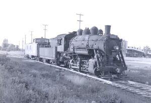 Canadien National | Montreal, Quebec, Canada | Class 0-6-0 #7469 steam locomotive and caboose | June 6 1953 | R. L. Long photograph | West Jersey Chapter, NRHSS
