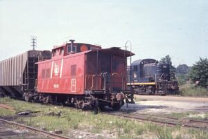 Central Railroad of New Jersey | Red Bank, New Jersey | Red Barron caboose #91521 | Alco RS3 #1542 diesel-electric locomotive | July 10, 1976 | Frank Battito photograph / Mitchell E. Dakelman collection