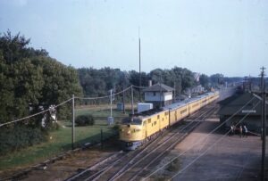 Chicago, Milwaukee, Saint Paul and Pacific Railroad | Milwaukee Railroad | Rondout, Illinois | EMD E7a #18A | Train 143 | with Station and Tower | September 7, 1960 | Al Holtz photograph / collection