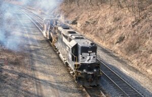 Norfolk Southern Corporation | Greensburg, Pennsylvania | EMD GP38-2 #5242 diesel-electric locomotive | Jordon Spreader #64621 | eastbound | March 4, 2002 | Dick Flock photograph / collection