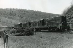 Pennsylvania Railroad | Baldwin RT624 #8954 + 1 diesel-electric locomotives | Horseshoe Curve | eastbound hopper train | 1958 | Ed Kaspriske photograph / collection
