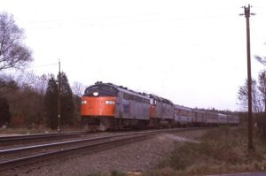Amtrak | Burke, Virginia | EMD E8a #215 + 1 diesel-electric locomotive | Train #51 The Cardinal | on Southern Railway | May 1975 | Ken Kulick photograph / collection
