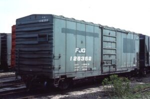 Fonda, Johnstown and Gloversville Railroad | Mansfield, Ohio | Green 40 foot 6 inch box car #128353 | ex Penn Central | June 16, 1977 | Emery Gulash photograph | Stephen Timko collection